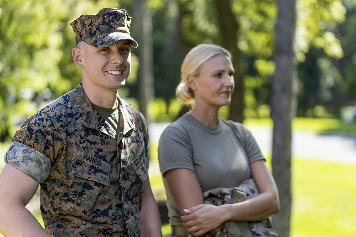 Male and female veterans standing next to each other. 